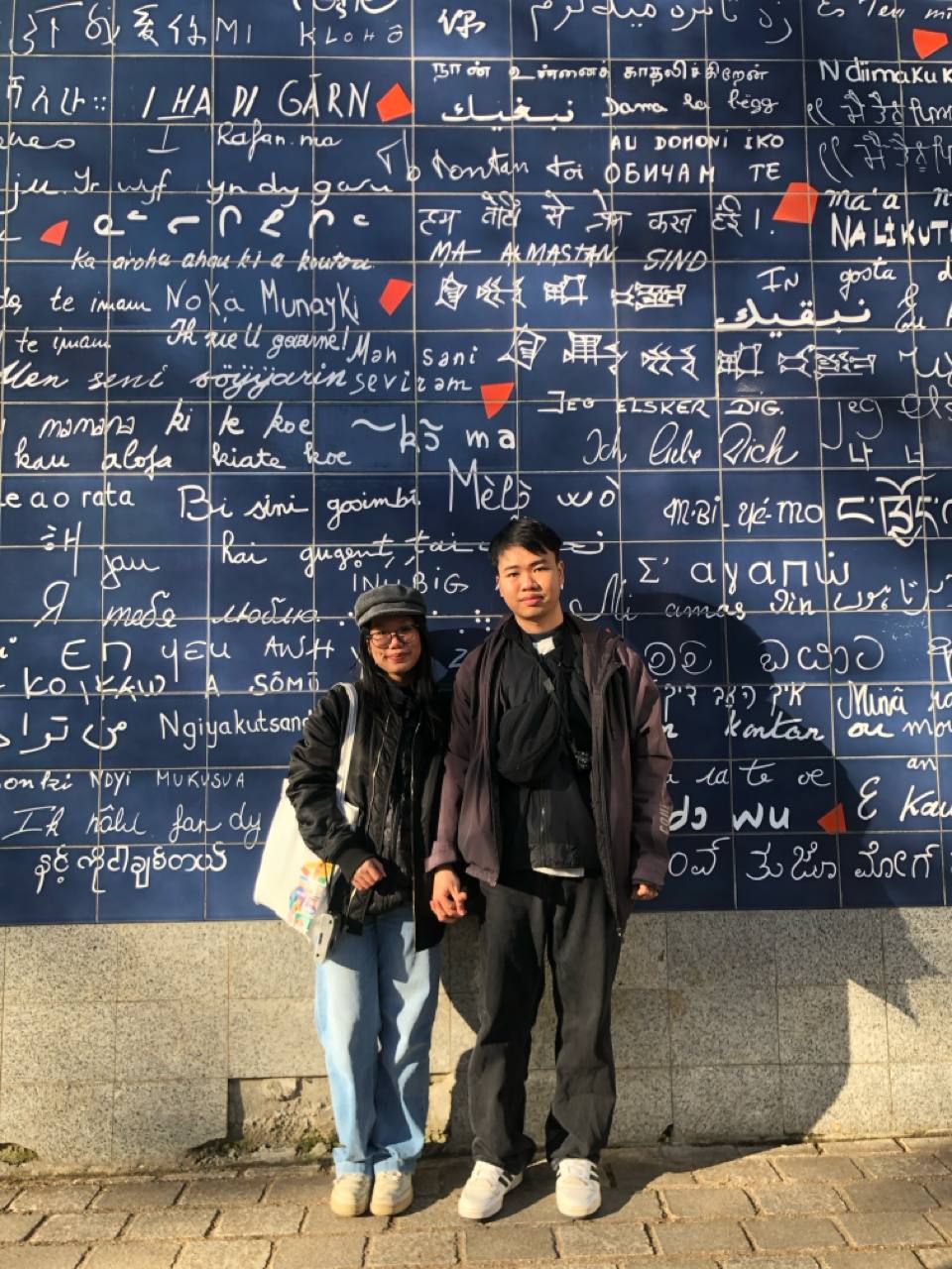 us together in front of the blue writing wall