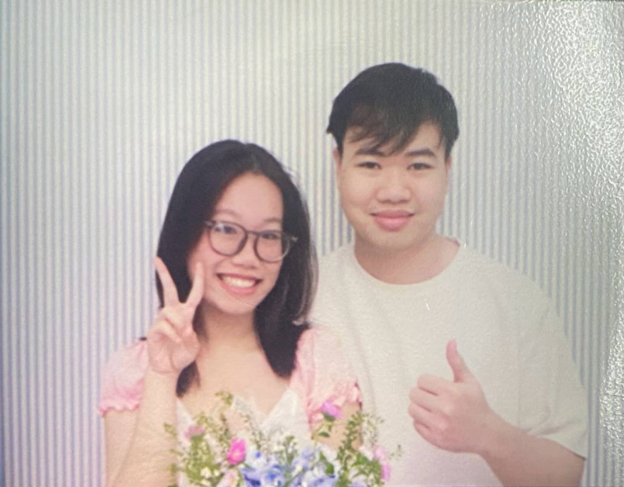 us smiling together with flowers