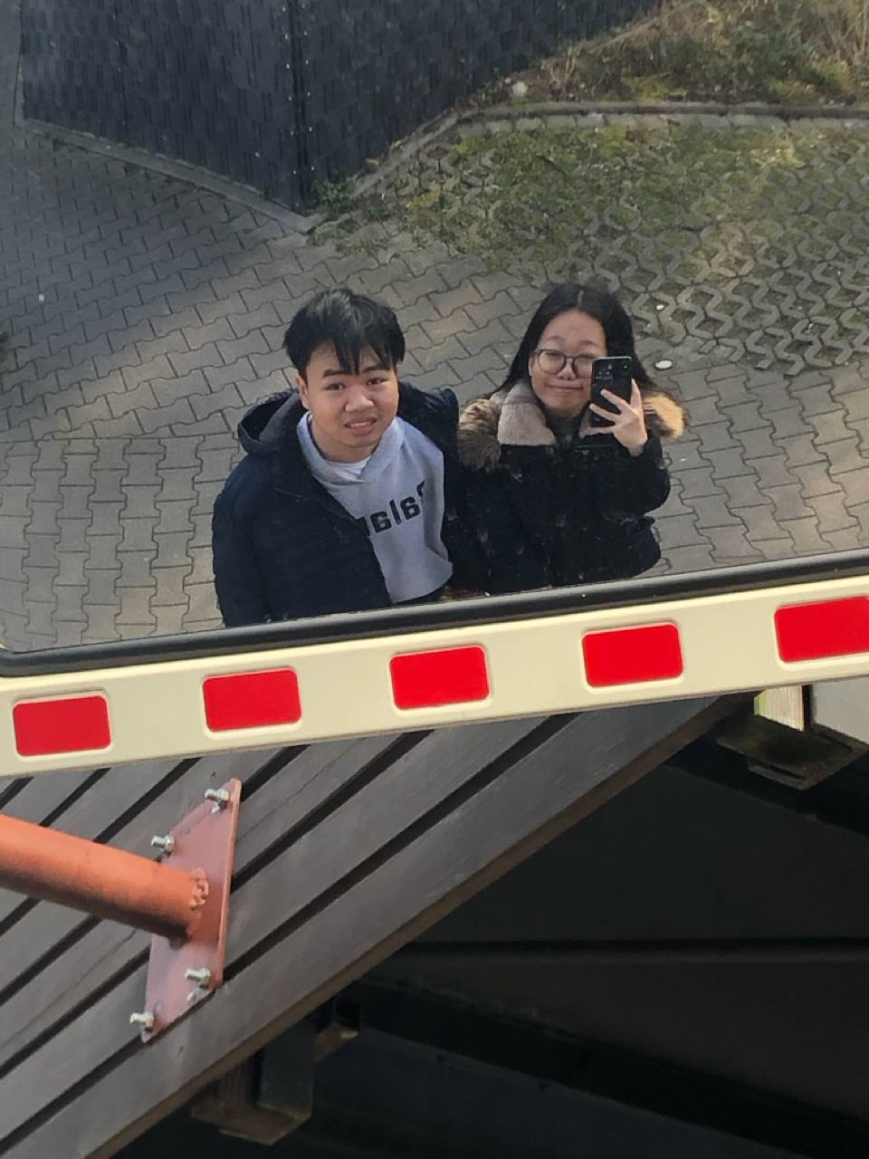 us looking up from beside a bridge