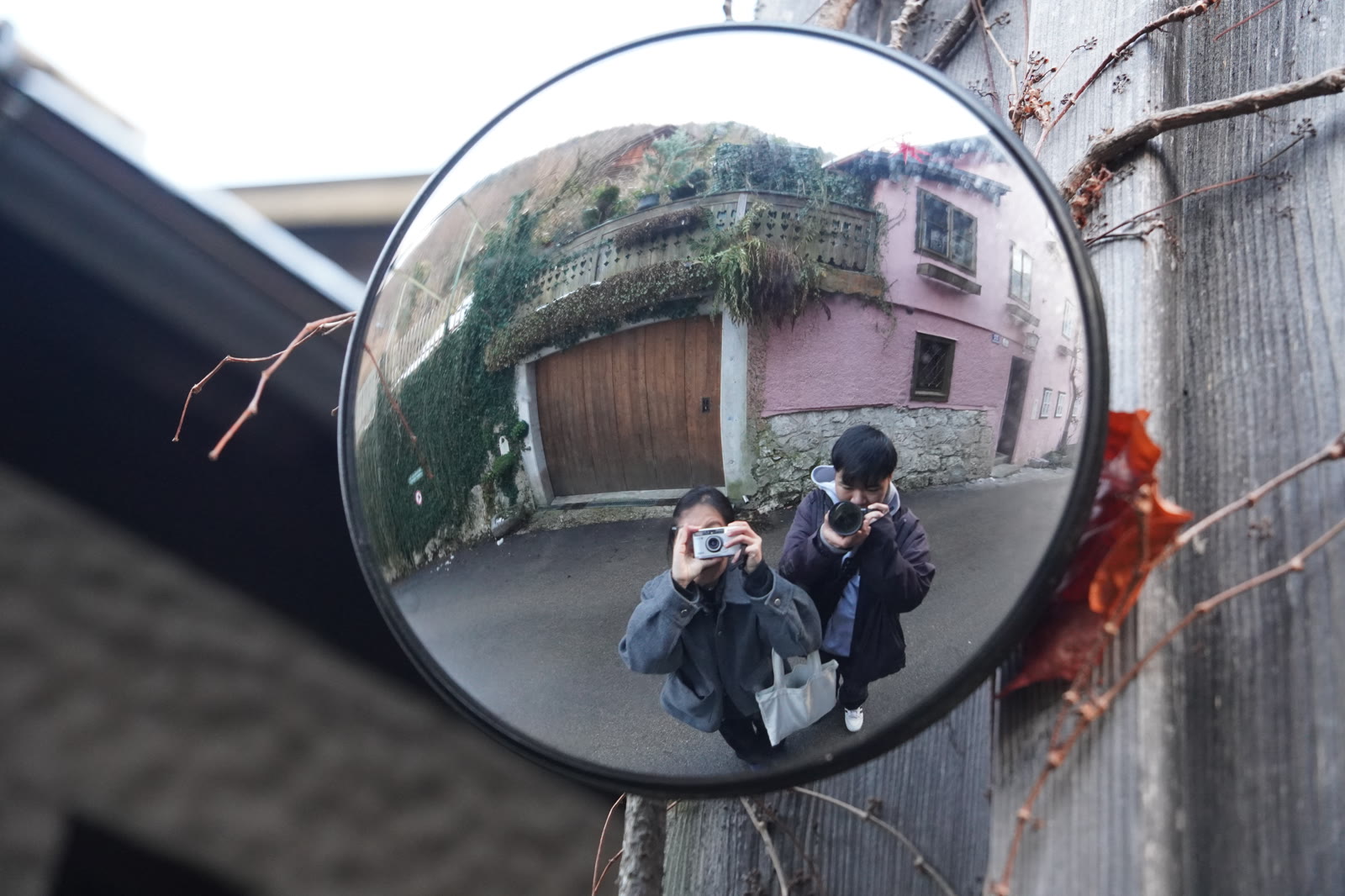 us reflected together in a street mirror